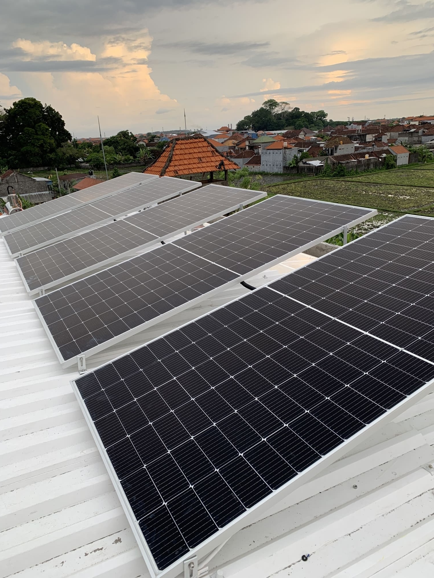 Wide view of a large solar panel installation on a roof