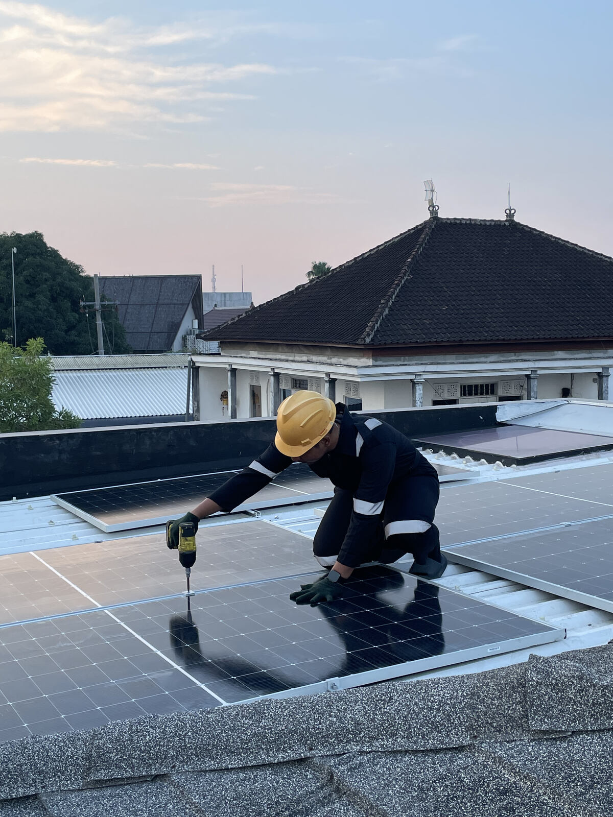 Wide view of a large solar panel installation on a roof