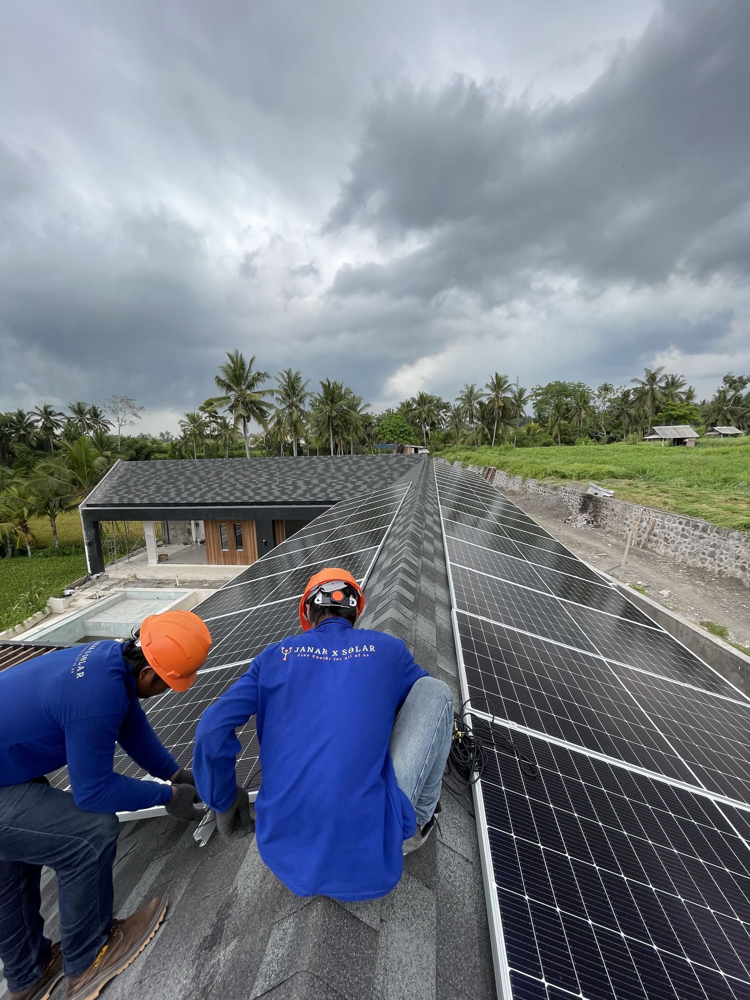 Solar panel technician using a tablet for live monitoring