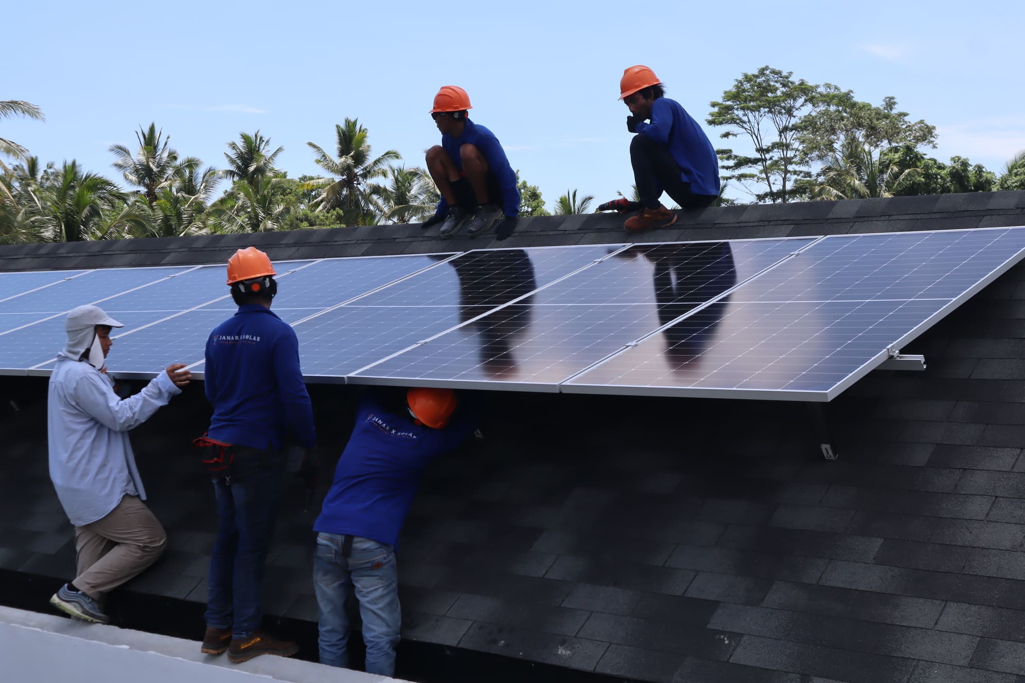 Team installing solar panels