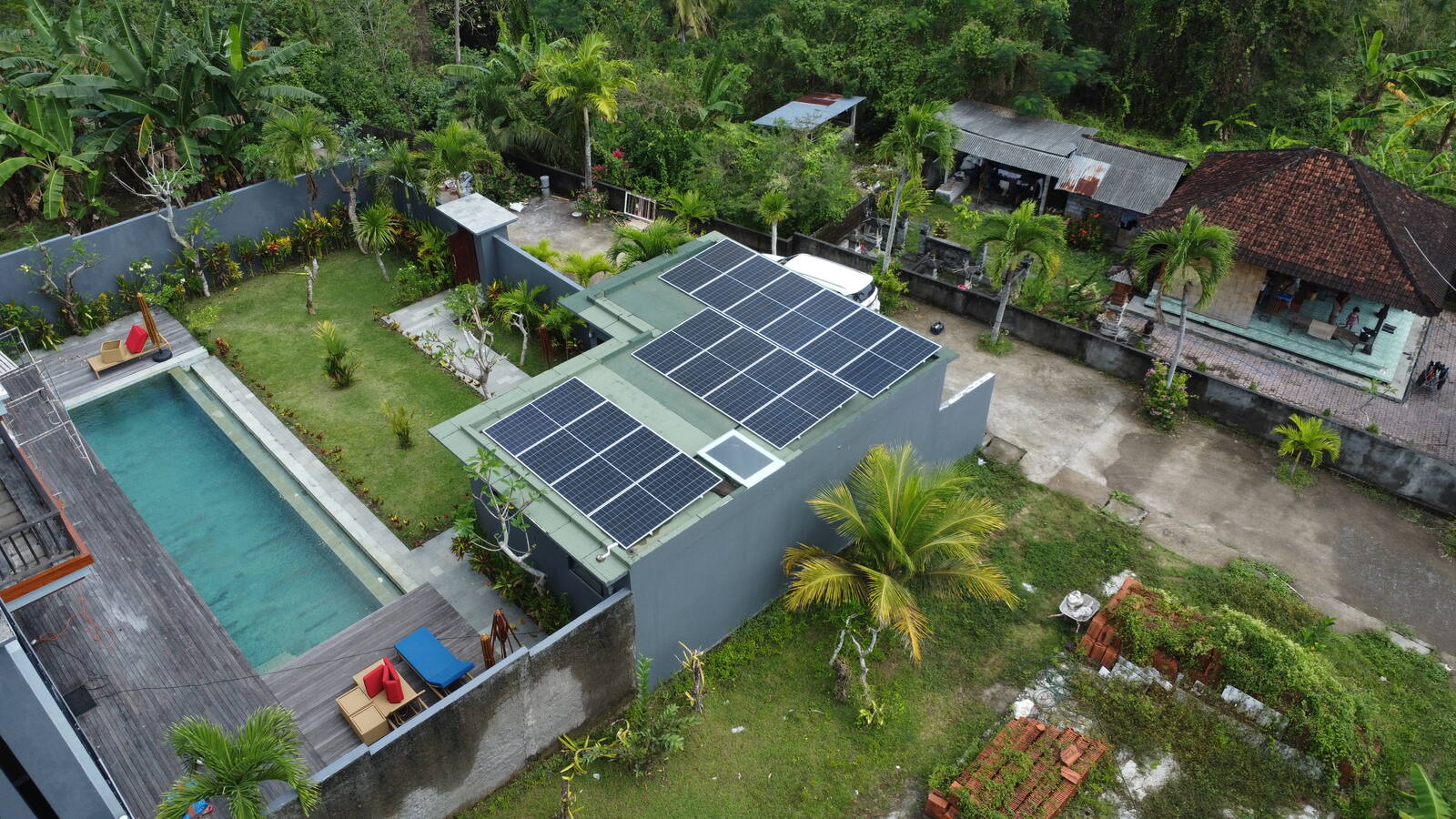 Solar panel technician using a tablet for live monitoring